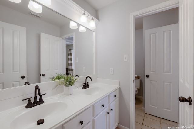 830 Emerald Bay, San Antonio, TX 78260 - bathroom with tile patterned floors, double vanity, and toilet