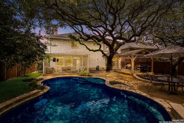 830 Emerald Bay, San Antonio, TX 78260 - pool at dusk featuring a gazebo, a patio area, and a fenced backyard