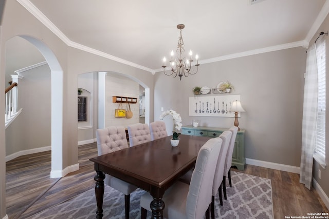 830 Emerald Bay, San Antonio, TX 78260 - dining area featuring baseboards, arched walkways, wood finished floors, a chandelier, and ornamental molding