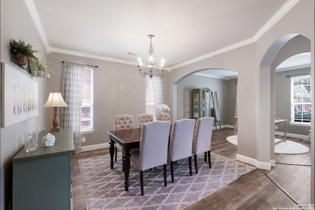 830 Emerald Bay, San Antonio, TX 78260 - dining space featuring a chandelier, wood finished floors, crown molding, arched walkways, and baseboards