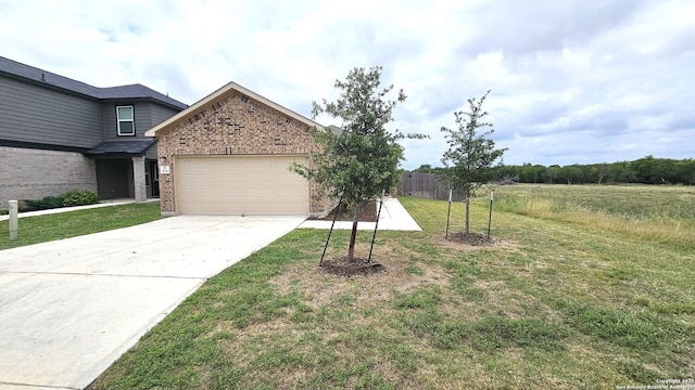 5930 Foster Bnd, San Antonio, TX 78244 - view of yard with an attached garage and concrete driveway