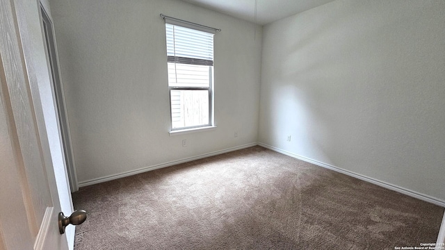 5930 Foster Bnd, San Antonio, TX 78244 - spare room featuring carpet flooring and baseboards