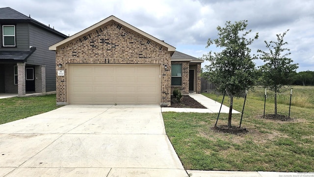 5930 Foster Bnd, San Antonio, TX 78244 - view of front of house with brick siding, driveway, and a garage