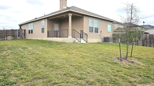 5930 Foster Bnd, San Antonio, TX 78244 - rear view of property featuring central AC and a chimney