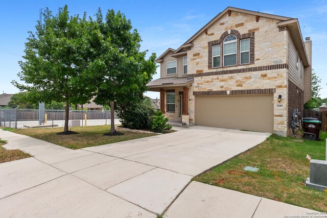 5509 Calaveras, San Antonio, TX 78253 - view of front of home featuring stone siding, a garage, and driveway