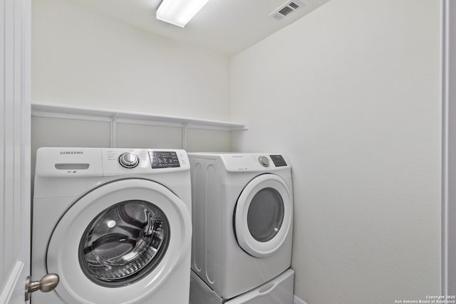 5509 Calaveras, San Antonio, TX 78253 - laundry room featuring washer and dryer