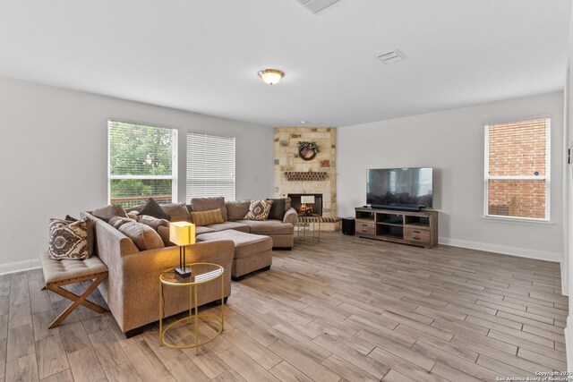5509 Calaveras, San Antonio, TX 78253 - living area featuring wood finished floors, a large fireplace, and baseboards