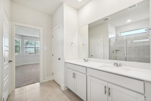 29508 Ringo Way, San Antonio, TX 78260 - full bathroom featuring double vanity, a stall shower, tile patterned floors, and baseboards