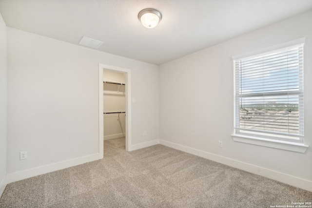 29508 Ringo Way, San Antonio, TX 78260 - unfurnished bedroom with light carpet, baseboards, a spacious closet, and a closet