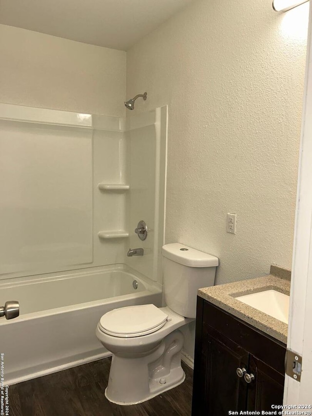 1807 Fresno, San Antonio, TX 78201 - full bath featuring vanity, toilet, shower / tub combination, wood finished floors, and a textured wall