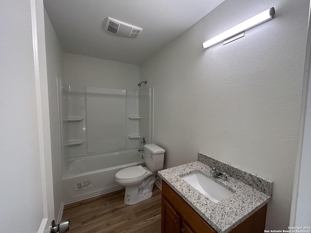 1807 Fresno, San Antonio, TX 78201 - bathroom with vanity, wood finished floors, toilet, and tub / shower combination