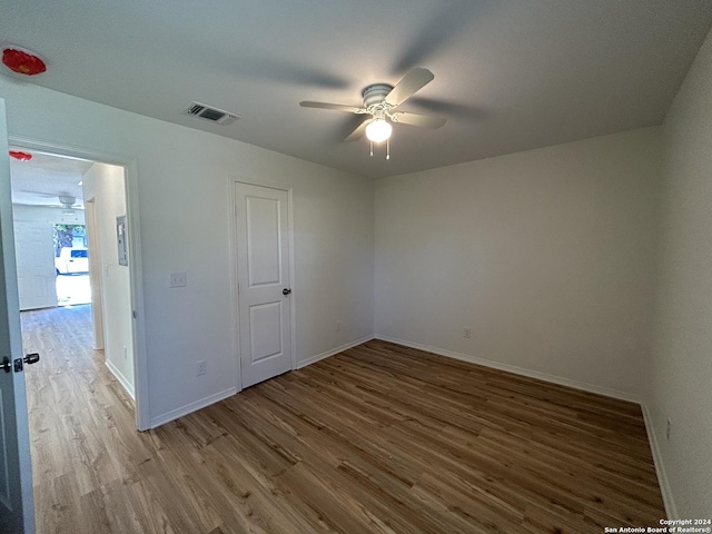 1807 Fresno, San Antonio, TX 78201 - unfurnished room with ceiling fan, wood finished floors, and baseboards