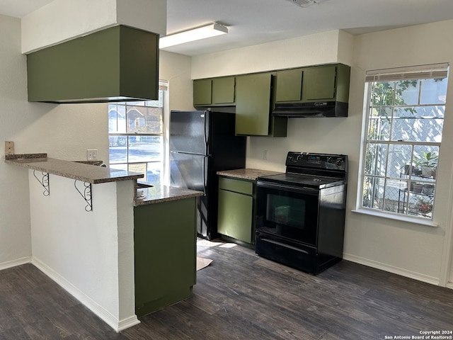 1807 Fresno, San Antonio, TX 78201 - kitchen with black appliances, green cabinets, dark wood-type flooring, a peninsula, and ventilation hood