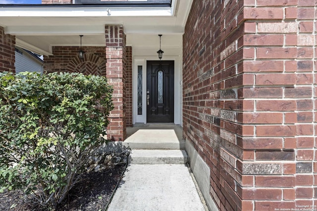 1011 Cat Mesa, San Antonio, TX 78251 - view of exterior entry featuring brick siding and a porch