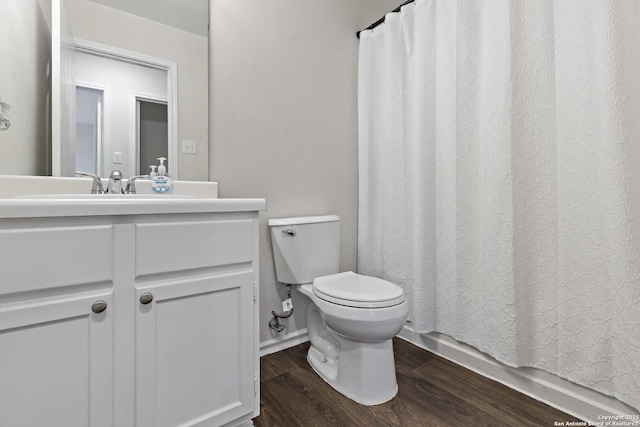 1011 Cat Mesa, San Antonio, TX 78251 - bathroom with toilet, vanity, wood finished floors, and shower / tub combo with curtain