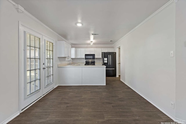 1011 Cat Mesa, San Antonio, TX 78251 - kitchen featuring black appliances, crown molding, plenty of natural light, light countertops, and white cabinets