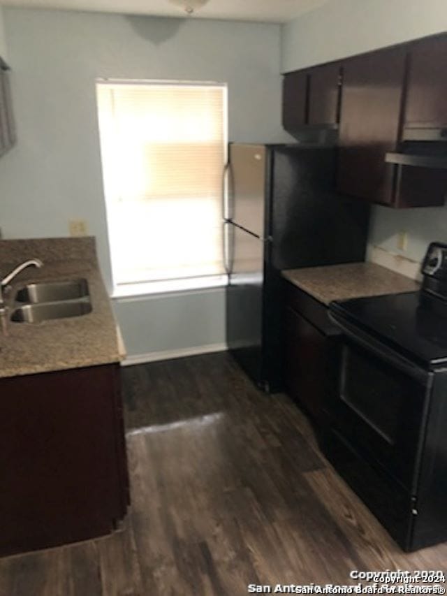 1811 Fresno, San Antonio, TX 78201 - kitchen with black electric range, a sink, and dark wood-style floors