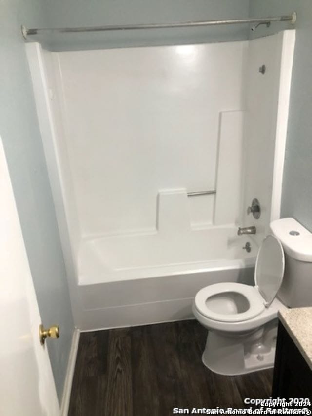 1811 Fresno, San Antonio, TX 78201 - bathroom with vanity,  shower combination, toilet, and wood finished floors