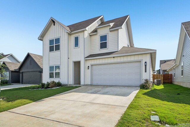 4538 Nueces, San Antonio, TX 78253 - view of front of house with board and batten siding, central AC unit, roof with shingles, and concrete driveway