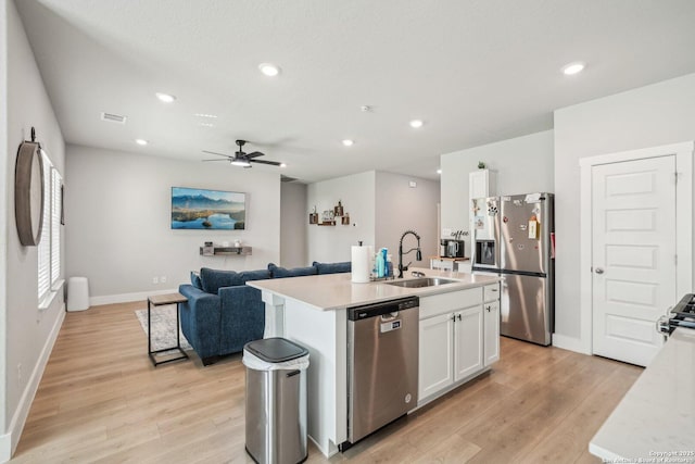 4538 Nueces, San Antonio, TX 78253 - kitchen featuring appliances with stainless steel finishes, a sink, baseboards, light countertops, and recessed lighting