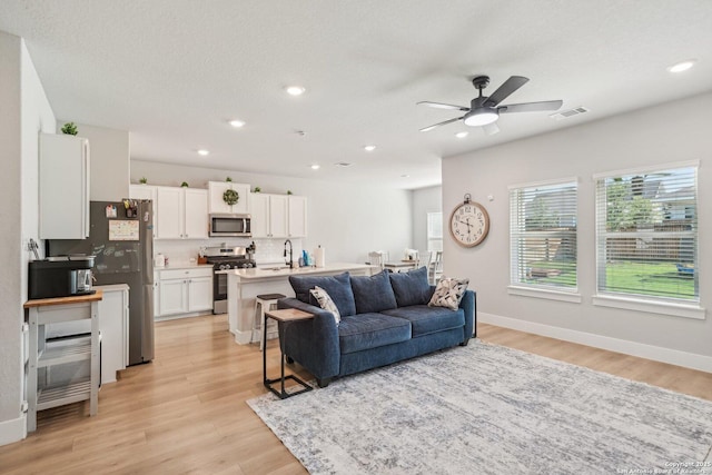 4538 Nueces, San Antonio, TX 78253 - living area with ceiling fan, light wood finished floors, recessed lighting, and baseboards