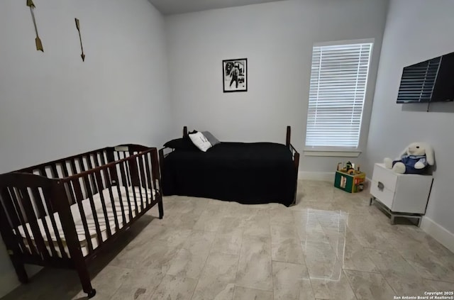 1726 Claudia Vis, San Antonio, TX 78224 - bedroom featuring a crib and baseboards