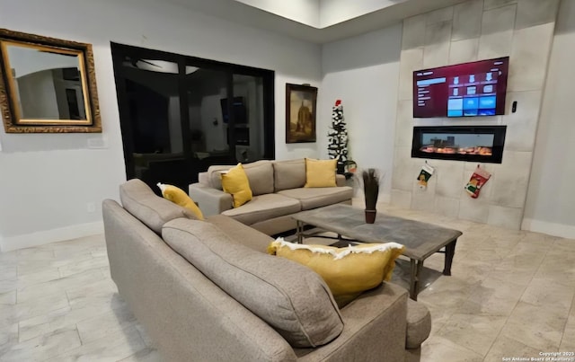 1726 Claudia Vis, San Antonio, TX 78224 - living room with baseboards, a tile fireplace, and light marble finish flooring