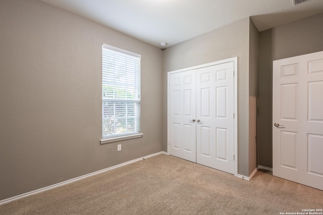 7566 Copper Kettle, Converse, TX 78109 - unfurnished bedroom with carpet floors, a closet, and baseboards