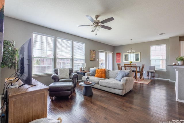 7566 Copper Kettle, Converse, TX 78109 - living room featuring a ceiling fan, a chandelier, dark wood-style floors, and baseboards