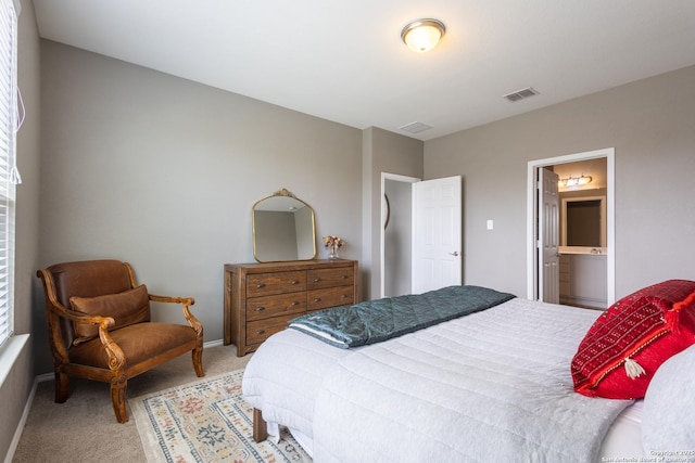 7566 Copper Kettle, Converse, TX 78109 - carpeted bedroom featuring ensuite bathroom and baseboards