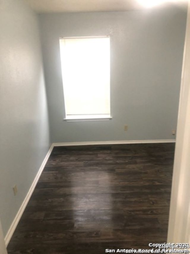1815 Fresno, San Antonio, TX 78201 - spare room featuring wood finished floors and baseboards
