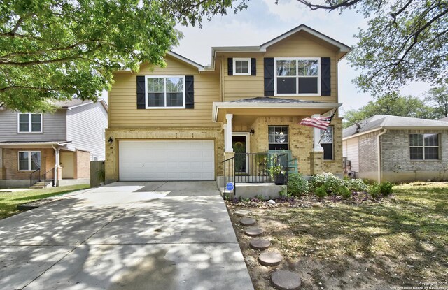 181 Foxglove, Cibolo, TX 78108 - view of front of property featuring driveway, an attached garage, and brick siding