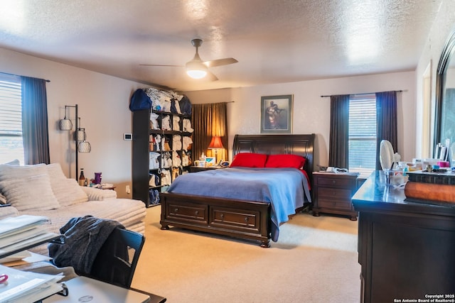 9930 Amber Breeze, San Antonio, TX 78245 - bedroom with light colored carpet, a textured ceiling, and a ceiling fan