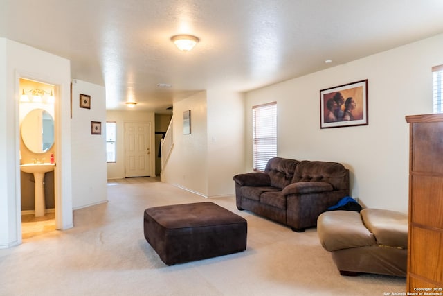9930 Amber Breeze, San Antonio, TX 78245 - living area with light colored carpet, stairway, and baseboards