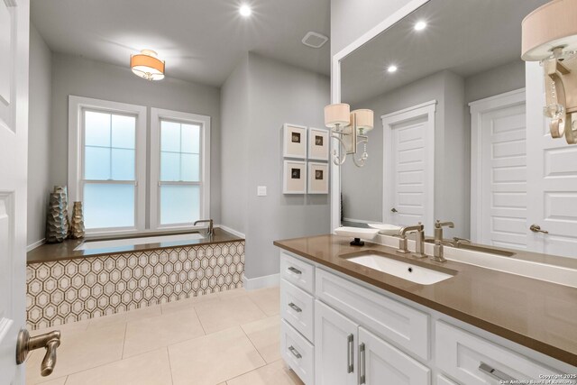 228 Cloverleaf, Alamo Heights, TX 78209 - bathroom featuring vanity, recessed lighting, baseboards, and tile patterned floors