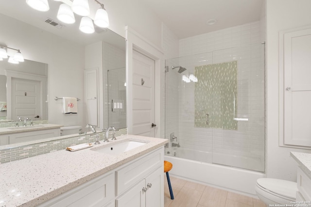 228 Cloverleaf, Alamo Heights, TX 78209 - full bathroom featuring toilet, vanity, and bath / shower combo with glass door