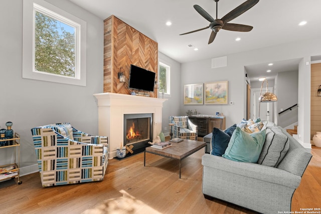228 Cloverleaf, Alamo Heights, TX 78209 - living room with ceiling fan, wood finished floors, a large fireplace, stairs, and recessed lighting