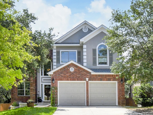 414 Aspen, San Antonio, TX 78253 - view of front of home with concrete driveway, brick siding, stucco siding, and an attached garage