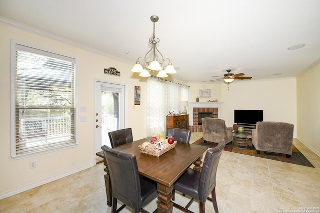 414 Aspen, San Antonio, TX 78253 - dining area featuring crown molding, a fireplace, a ceiling fan, a chandelier, and baseboards