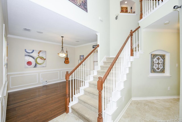 414 Aspen, San Antonio, TX 78253 - stairway with ornamental molding, a decorative wall, and a wainscoted wall
