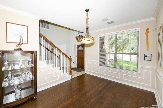 414 Aspen, San Antonio, TX 78253 - entryway featuring dark wood-type flooring, crown molding, a decorative wall, stairway, and a wainscoted wall