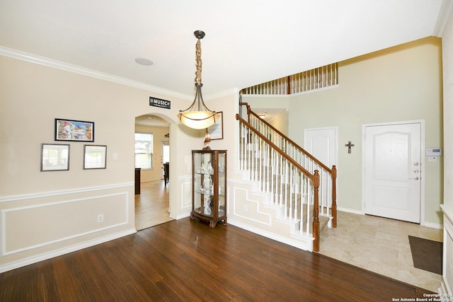 414 Aspen, San Antonio, TX 78253 - entrance foyer with arched walkways, stairs, ornamental molding, wood finished floors, and baseboards