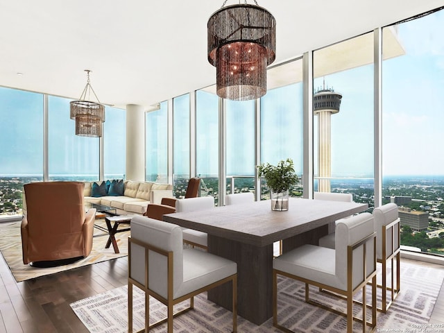610 E Market Unit 3007, San Antonio, TX 78205 - dining room featuring a wall of windows, a chandelier, and wood finished floors