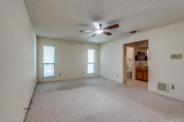 15314 Artesian Oaks, San Antonio, TX 78232 - spare room with a ceiling fan, a textured ceiling, and light carpet