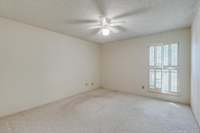 15314 Artesian Oaks, San Antonio, TX 78232 - unfurnished room with light carpet, a ceiling fan, and a textured ceiling