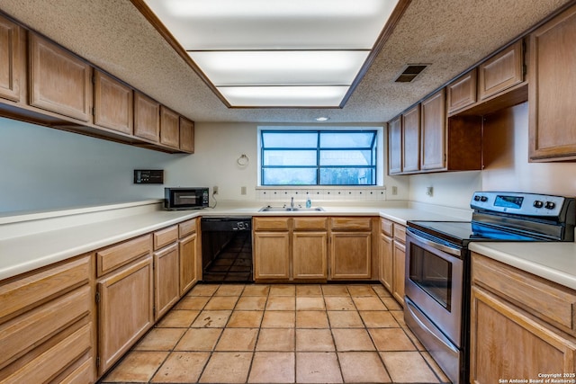 15314 Artesian Oaks, San Antonio, TX 78232 - kitchen featuring black appliances, a sink, and light countertops