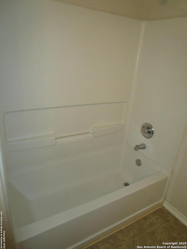 11011 Crystal Pln, Live Oak, TX 78233 - full bathroom with bathing tub / shower combination, baseboards, and tile patterned floors