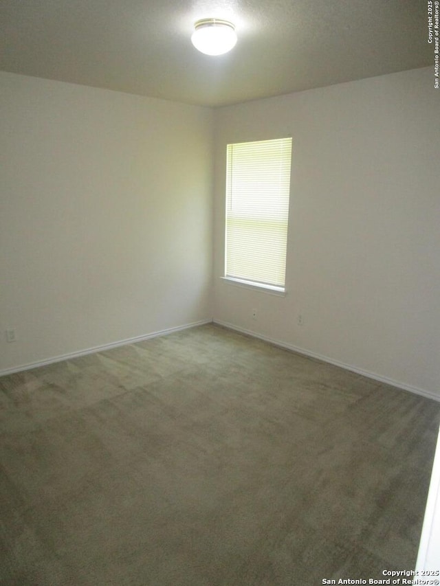 11011 Crystal Pln, Live Oak, TX 78233 - empty room featuring carpet floors and baseboards