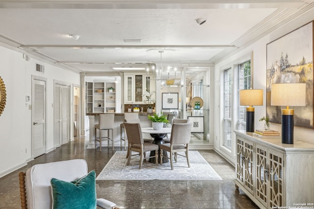 209 Chichester Pl Unit 1, San Antonio, TX 78209 - dining area with baseboards, a chandelier, and crown molding