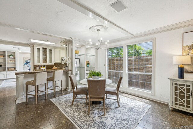 209 Chichester Pl Unit 1, San Antonio, TX 78209 - dining room with a chandelier, a tray ceiling, and ornamental molding